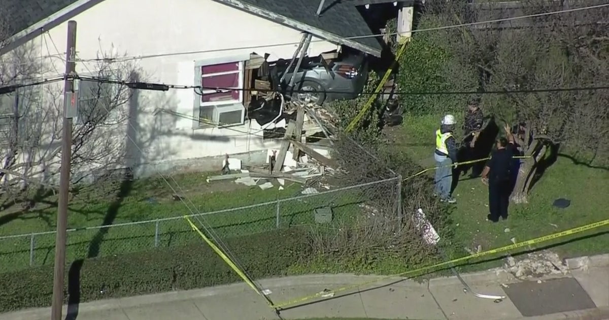 1 Hospitalized After Car Crashes Into House In Dallas - CBS Texas