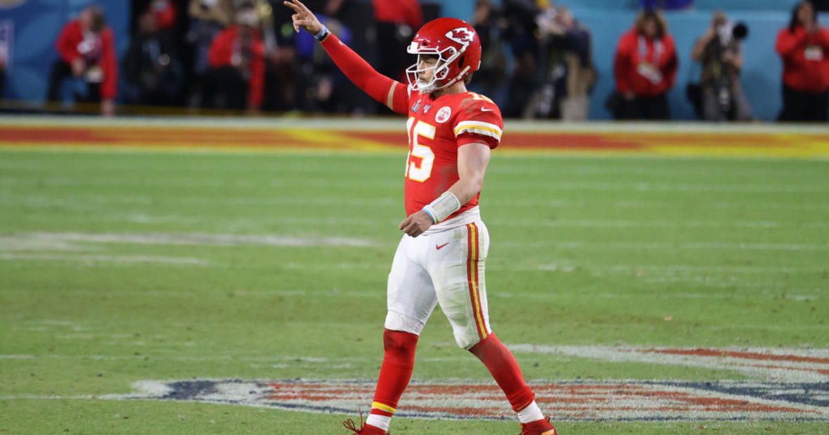 Kansas City Chiefs' Demone Harris (52) plays with the confetti, at