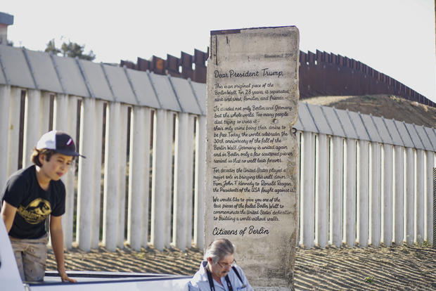 Portion Of Berlin Wall With Letter To President Trump Written On Road Goes On Display At U.S. Mexico Border 