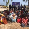 Rohingya refugees wait after their boat capsized near the Saint Martin's island in the Bay of Bengal, in Teknaf, near Cox's Bazar 