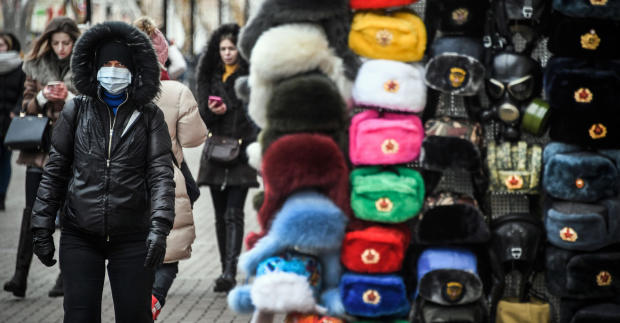 People walk along Arbat pedestrian street in downtown Moscow on February 19, 2020. 