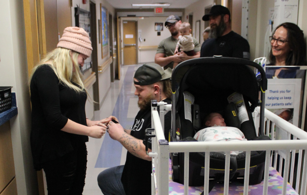 Dad proposes to mom outside NICU