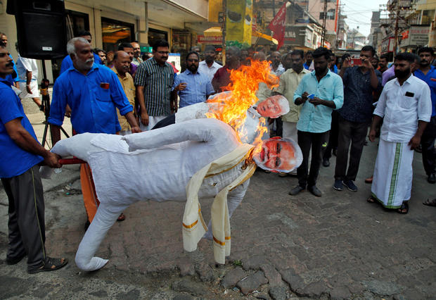 Supporters of Centre of India Trade Union (CITU) burn effigies depicting U.S President Donald Trump and India's Prime Minister Narendra Modi during a protest against Trump's visit to India, in Kochi 