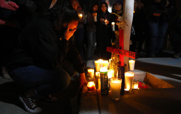 Activists place candles during a protest against femicides in Ciudad Juarez, Mexico, on January 25, 2020. 