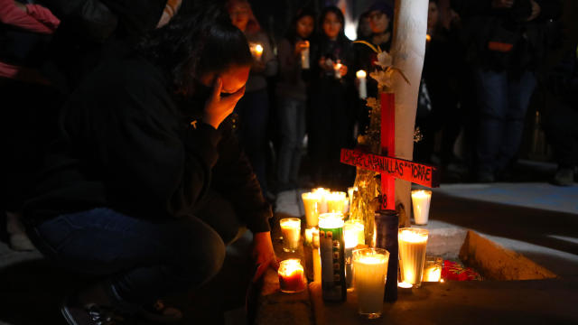 Activists place candles during a protest against femicides in Ciudad Juarez, Mexico, on January 25, 2020. 