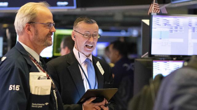 Traders work on the trading floor of the Amex Futures market at the New York Stock Exchange (NYSE) in New York 