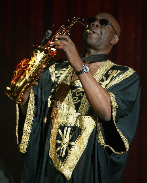 FILE PHOTO: Camoroonese musician Manu Dibango plays his saxaphone during French designer Sorbier's Spring/Summer.. 