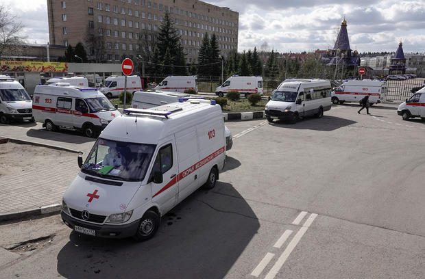 Ambulances queue before driving onto the adjacent territory of a local hospital in Khimki 
