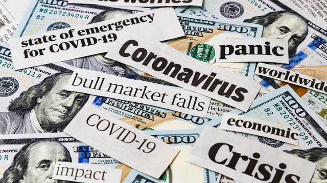 Coronavirus, covid-19 news headlines on United States of America 100 dollar bills. Concept of financial impact, stock market decline and crash due to worldwide pandemic 