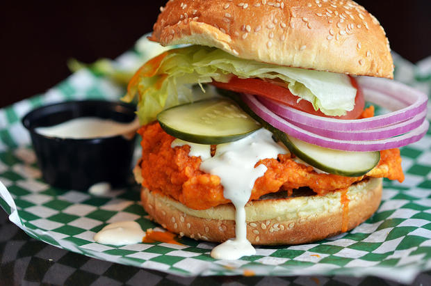 Juicy Buffalo Chicken Sandwich with Pickles, Red Onions, Ranch Dressing 