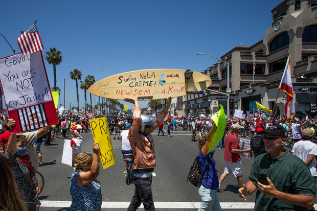 Protest To Reopen California Businesses, Beaches, And Parks Held In Huntington Beach 