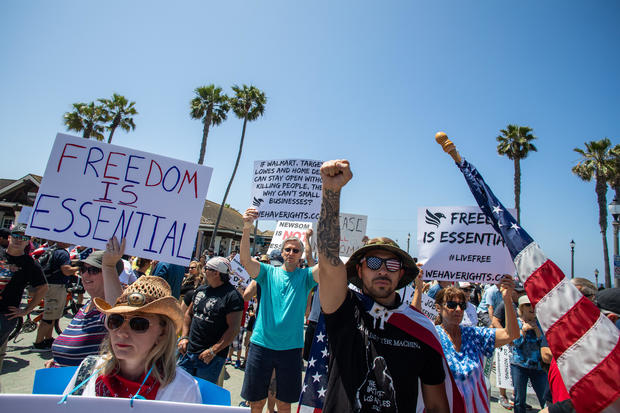Protest To Reopen California Businesses, Beaches, And Parks Held In Huntington Beach 
