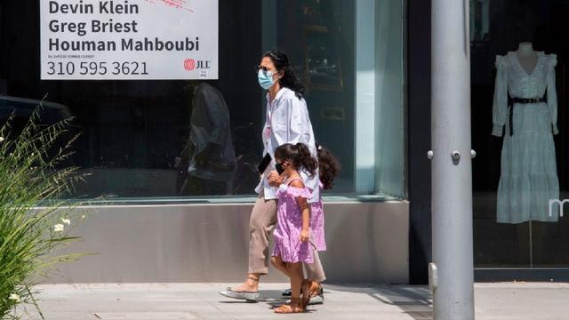 mother-daughter-walking-masks.jpg 