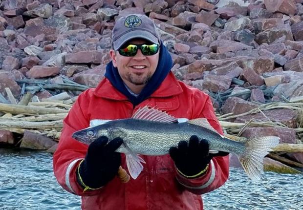 CPW aquatic biologist Paul Foutz displays a walleye caught at Lake Pueblo State Park. Photo courtesy CPW Bill Vogrin 