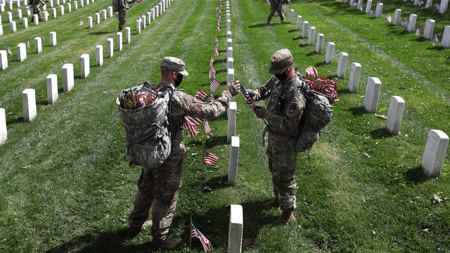 Arlington National Cemetery Holds Annual Flags-In To Honor Fallen For Memorial Day 