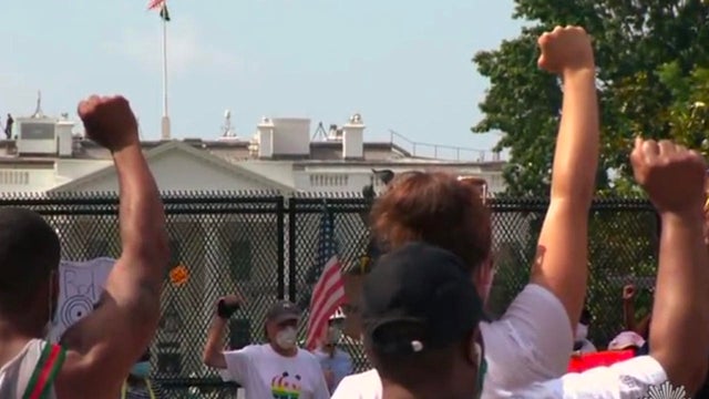 protest-outside-white-house-fence-promo.jpg 