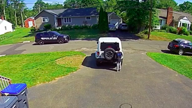 boy hides from police car 