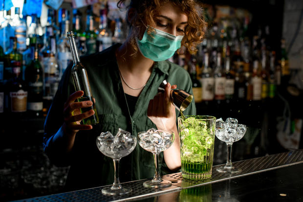 bar bartender girl in a medical mask alcohol liquor cocktail 