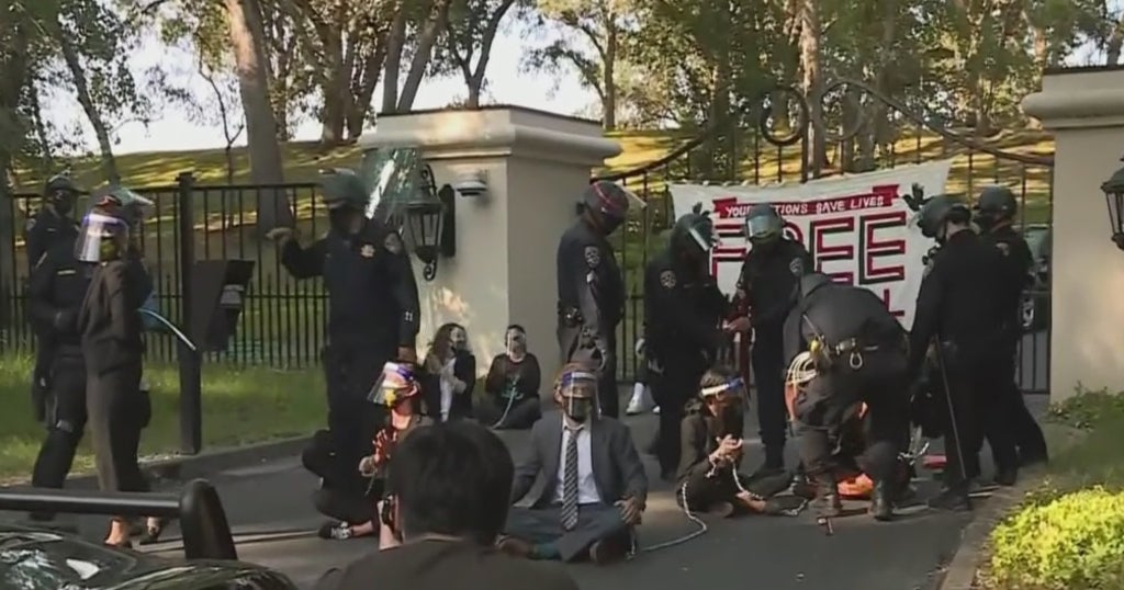 Protesters Chain Themselves To Governor's Home As Prison COVID Deaths ...