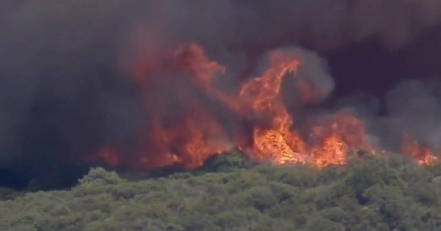 Heat wave fueling wildfires in California, forcing evacuations - CBS News