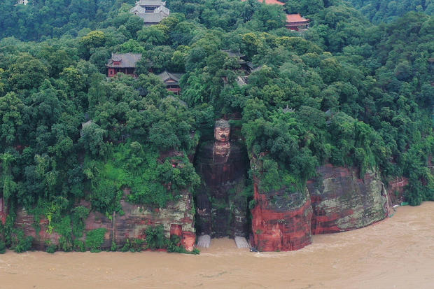 Floodwater reaches the Leshan Giant Buddha's feet following heavy rainfall, in Leshan, Sichuan 
