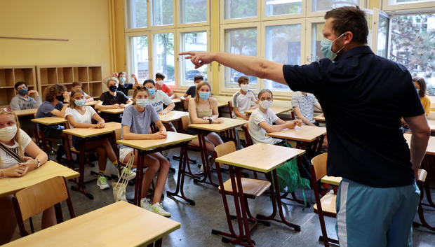 Pupils of the protestant high school "Zum Grauen Kloster" attend a lesson on the first day after the summer holidays in Berlin 