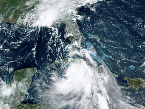 Tropical Storm Marco, top, arrives at the coast of Louisiana as Tropical Storm Laura follows in an image from the National Oceanic and Atmospheric Administration GOES-East satellite August 24, 2020. 