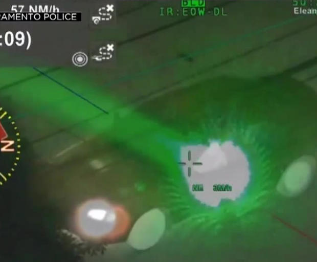 car targets helicopter with laser 