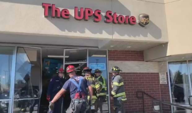 Car Into UPS Store 2 (still from SMF video) 