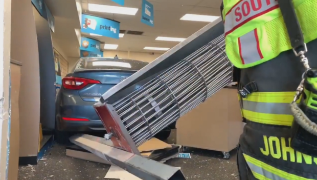 Car Into UPS Store 1 (still from SMF video) 