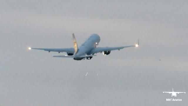 Sparks appear near the engine of Air Force 2, which carried U.S. Vice President Mike Pence, as the plane strikes a bird during takeoff at Manchester, New Hampshire 