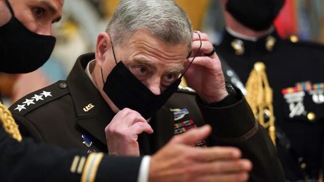 Milley puts his mask back on after U.S. President Donald Trump presented the Medal of Honor in Washington 