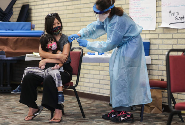 Southern California Residents Line Up For Flu Shots At Local Library 