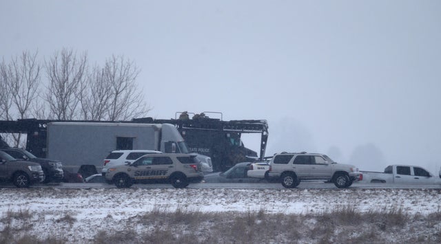 Gunman barricades himself in car along Illinois interstate after critically wounding sheriff's officer 