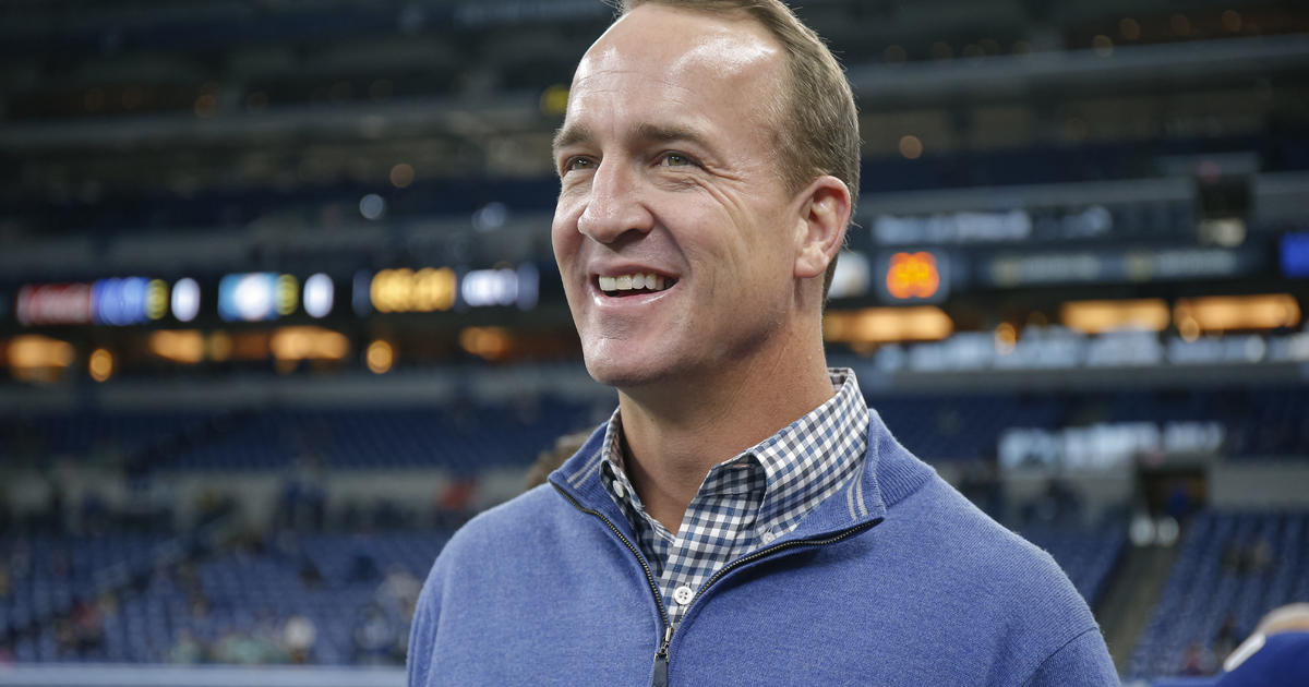 Peyton Manning of the Denver Broncos runs on the field in the first News  Photo - Getty Images