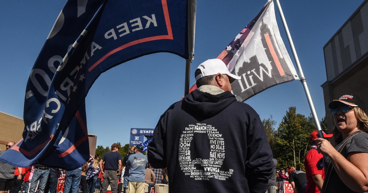 Documentary explores the disturbing appeal of QAnon - CBS News