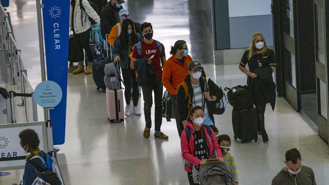 Travelers At SFO Airport As U.S. Holiday Air Travel Surges 