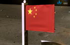 Handout image of China's national flag unfurled from the Chang'e-5 spacecraft 