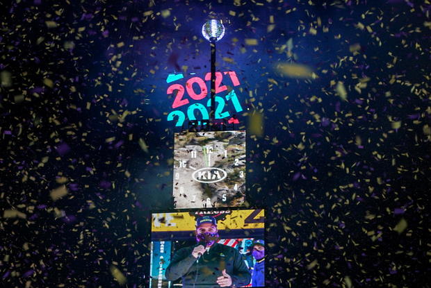 Confetti flies around the ball and countdown clock in Times Square during the virtual New Year's Eve event following the outbreak of the coronavirus disease (COVID-19) in the Manhattan borough of New York City 