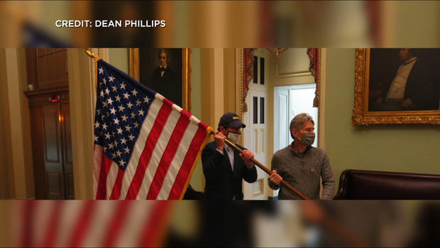 Dean Phillips Carries US Flag In Capitol 