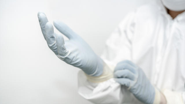 CDC staff are wearing protective gloves 