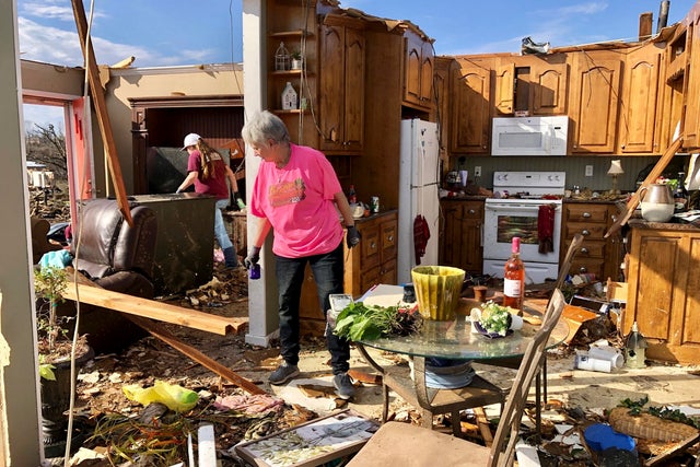 Patti Herring sobs as she sorts through the remains of her home in Fultondale, Alabama, on January 26, 2021, after it was destroyed by a tornado. 