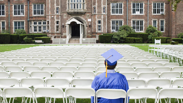 Graduate sitting alone 