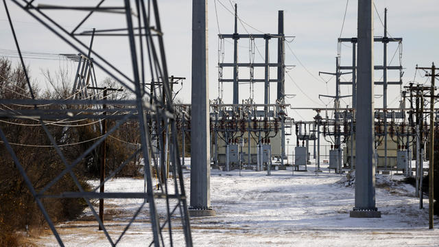 Transmission towers and power lines lead to a substation after a snowstorm on February 16, 2021, in Fort Worth, Texas. 