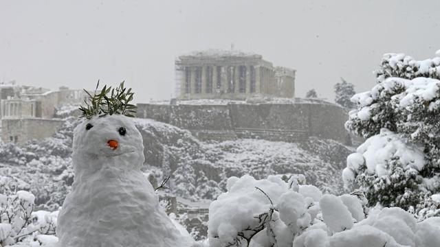 A woman walking along the snow-covered road in Istanbul 