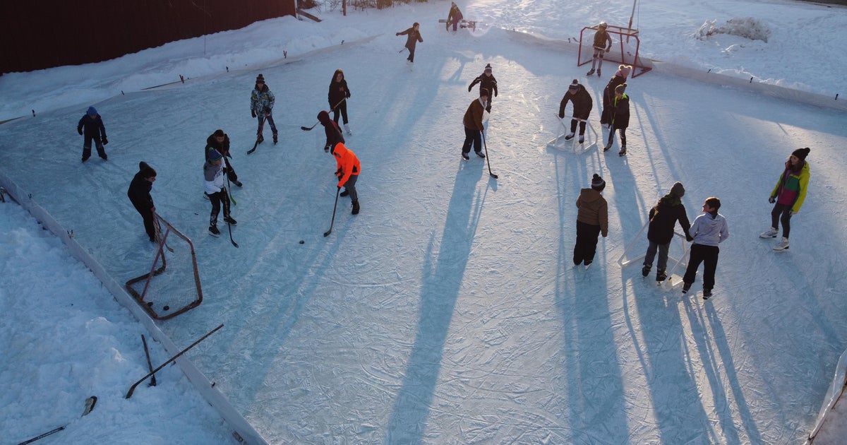 Ice rink brings Michigan community together during dark winter - CBS News