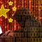 Chinese hacker at work in front of red flag 