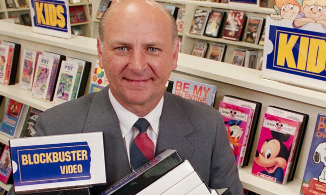 Man with Armload of Videos 