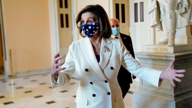 Speaker of the House Pelosi walks to the House floor for the final vote on President Biden's coronavirus (COVID-19) relief bill at the U.S. Capitol in Washington 