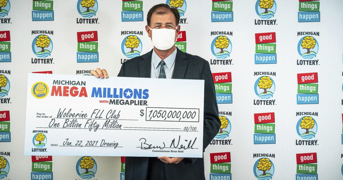 Man claims $4 million lottery prize with dog, plans donation for